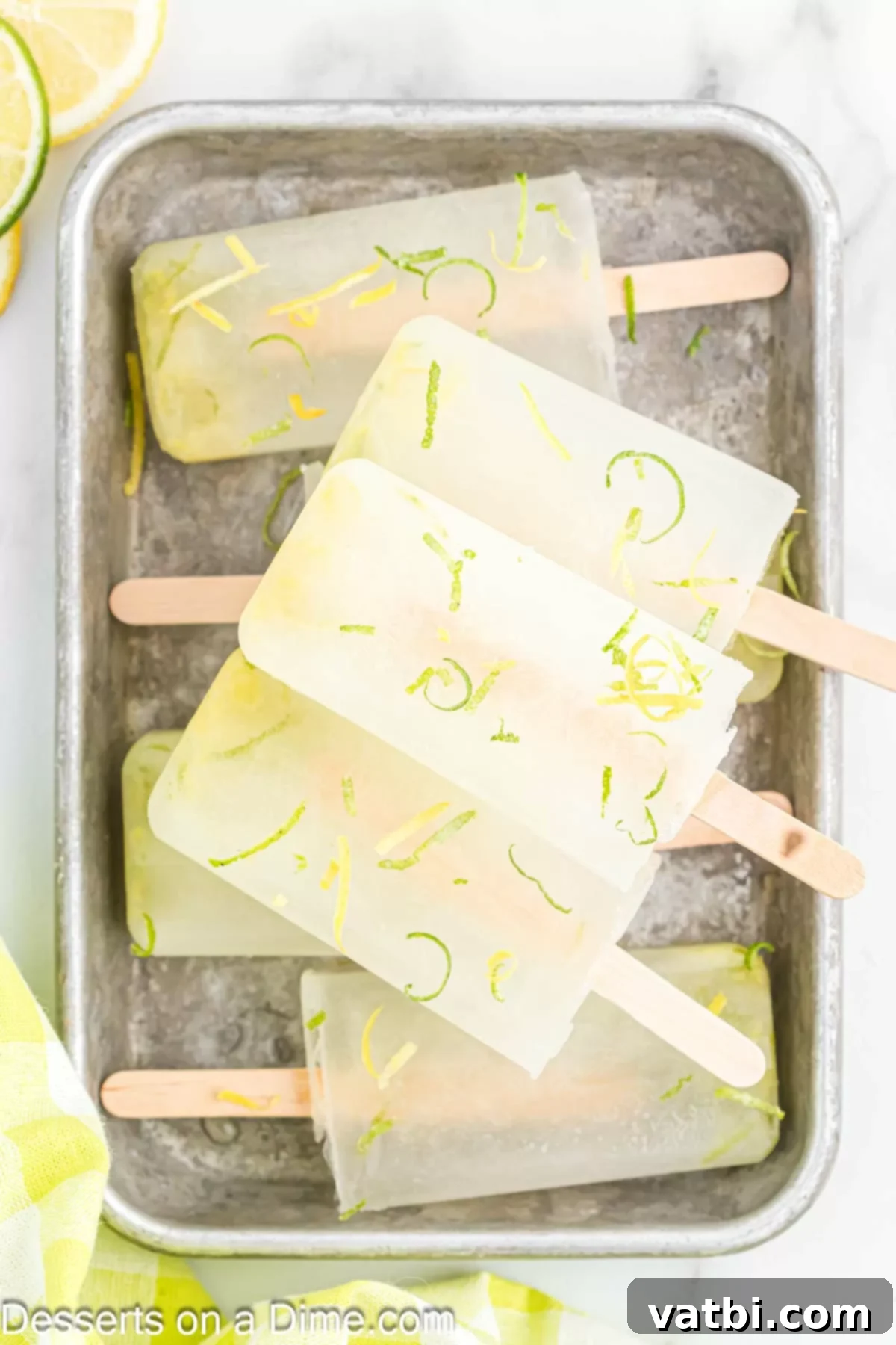Sunshine Citrus Pops 8 A vibrant lemon lime popsicle, perfectly unfrozen and ready to be savored on a hot day.
