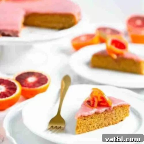 Zesty Delights 8 A slice of vibrant Blood Orange Cake on a plate, showcasing its striking color.