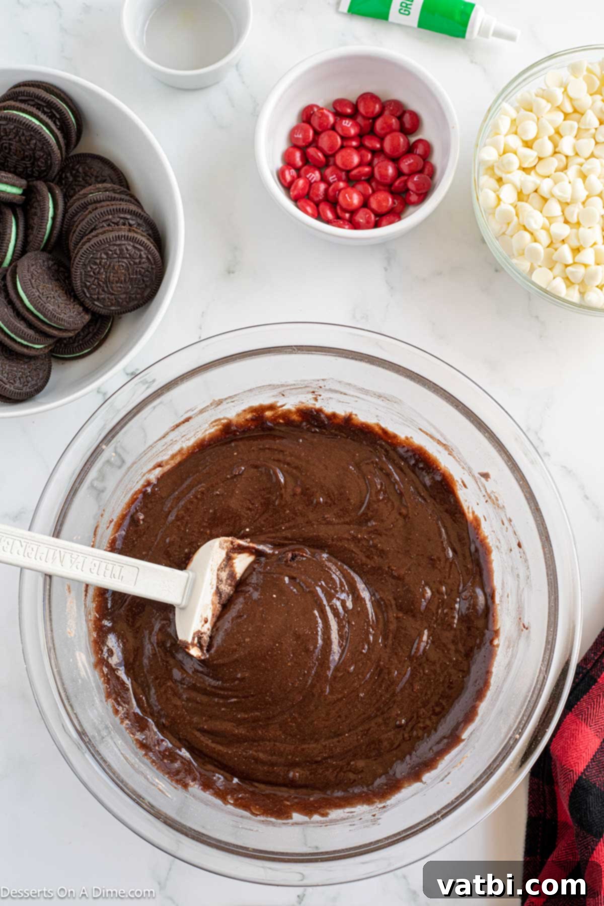 Grinch's Festive Fudgies 4 Brownie batter in a mixing bowl, ready to be poured into the pan.