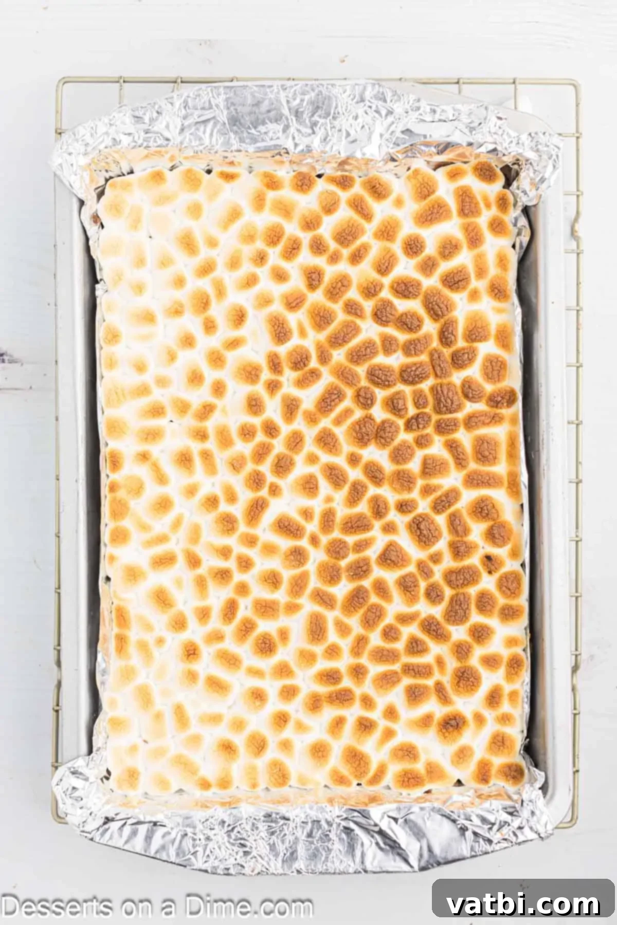Gooey S'mores Brownie Bliss 8 Marshmallows broiled to a perfect lightly golden-brown, creating a gooey and toasted topping.