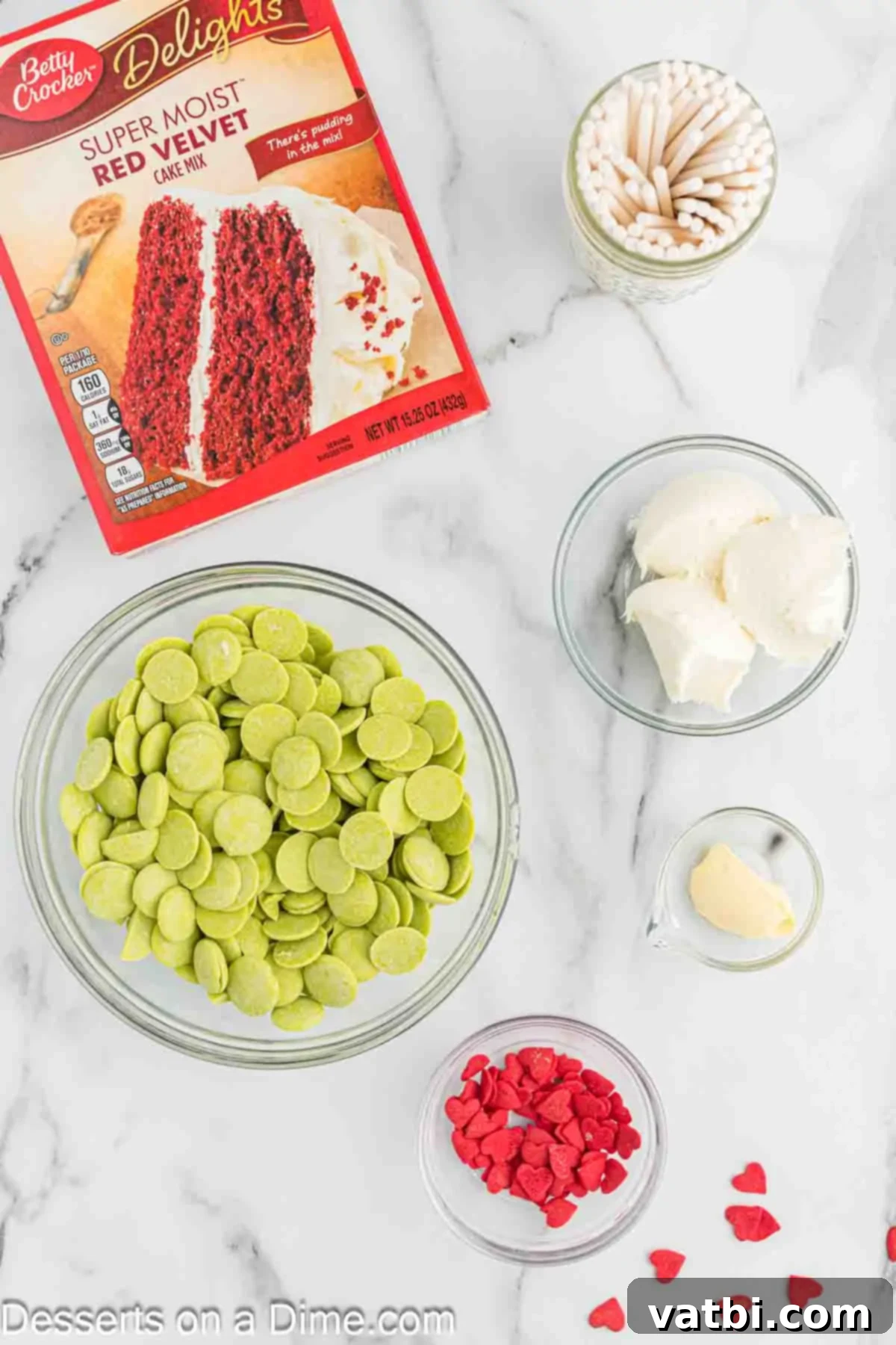 Whoville Grinch Cake Pops 3 Ingredients for Grinch Cake Pops - red velvet cake mix, cream cheese frosting, cake pop sticks, green candy melts, vegetable shortening, candy hearts