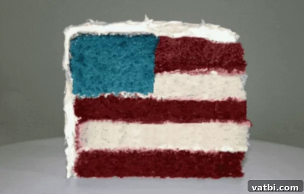 A rectangular 4th of July Flag Cake decorated with red, white, and blue toppings.