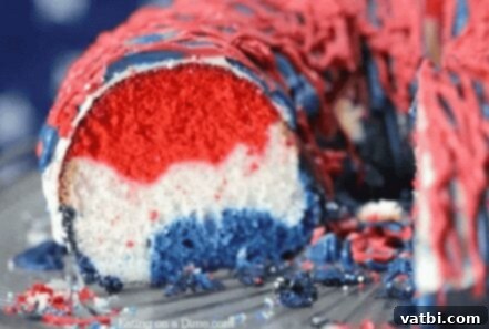 A slice of Red, White, and Blue Cake on a plate.