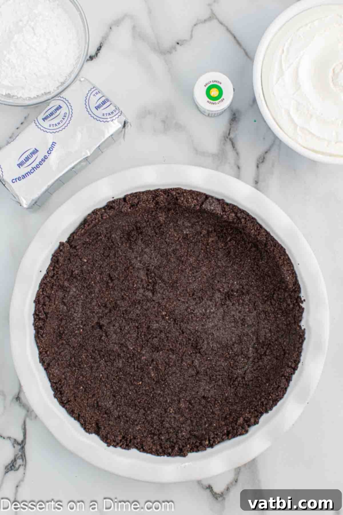 The Grinch's Heart-Melting Holiday Pie 5 Pressing the oreo crust mixture into the pie plate to form the base
