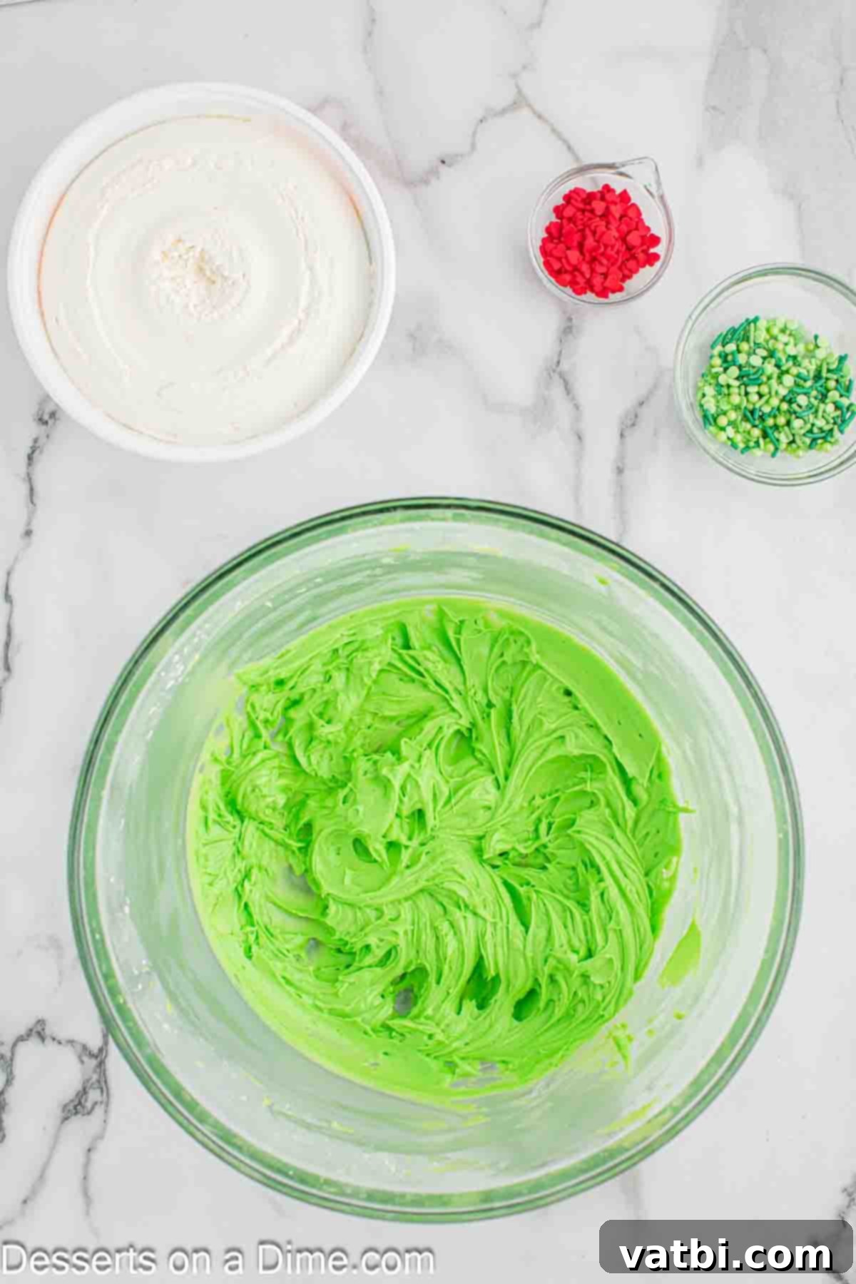 The Grinch's Heart-Melting Holiday Pie 7 Adding green gel food coloring into the cream cheese mixture until desired shade is achieved
