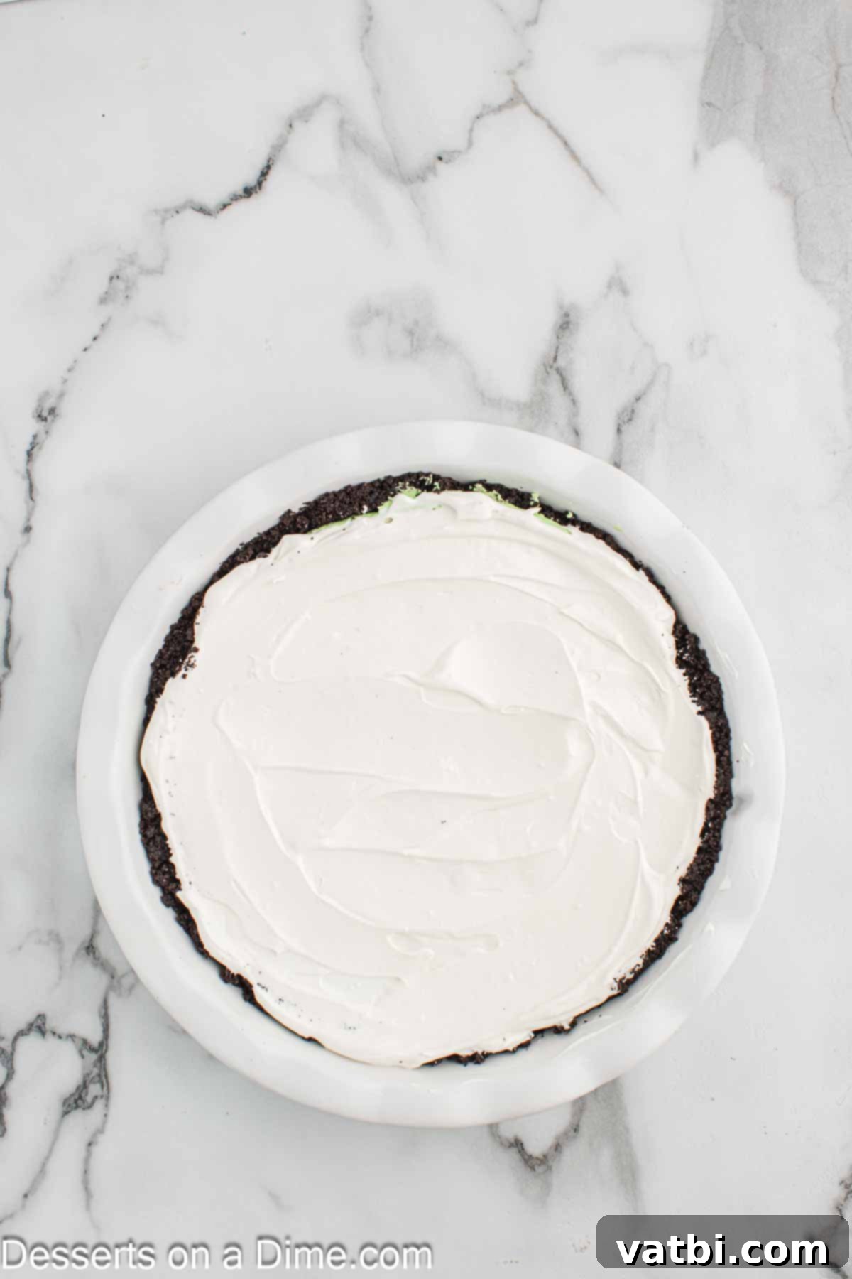 The Grinch's Heart-Melting Holiday Pie 10 Spreading the remaining cool whip over the top of the green pie filling