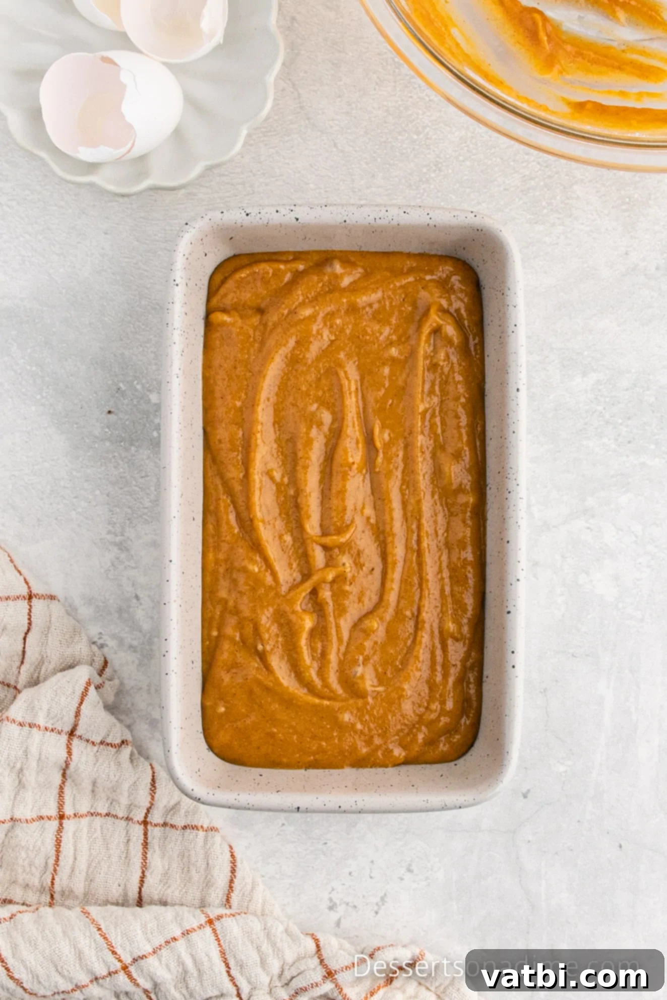 Libby's Pumpkin Bread Recipe 6 Pumpkin bread batter spread evenly into a prepared loaf pan, ready for baking.