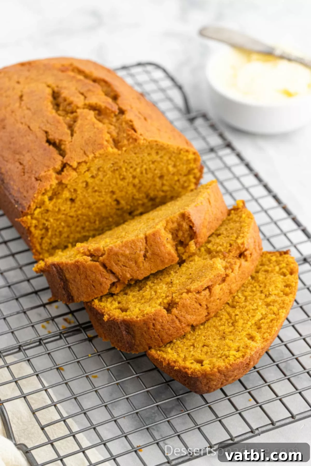 Libby's Pumpkin Bread Recipe 8 A perfectly baked loaf of pumpkin bread, sliced and ready to serve.