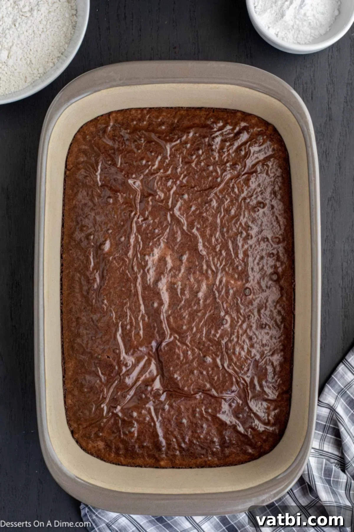 Decadent Deep-Fried Brownies 4 Freshly baked brownies cooling in a 9x13 inch baking pan.
