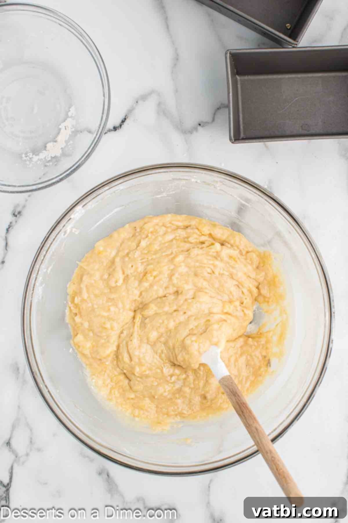 Moist Air Fryer Banana Bread 5 Dry ingredients added to mixture in bowl.