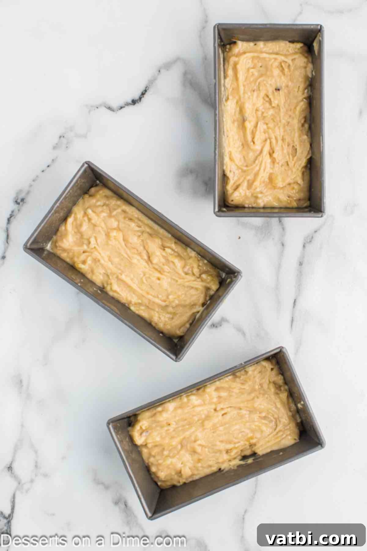 Moist Air Fryer Banana Bread 6 Batter poured into loaf pans.