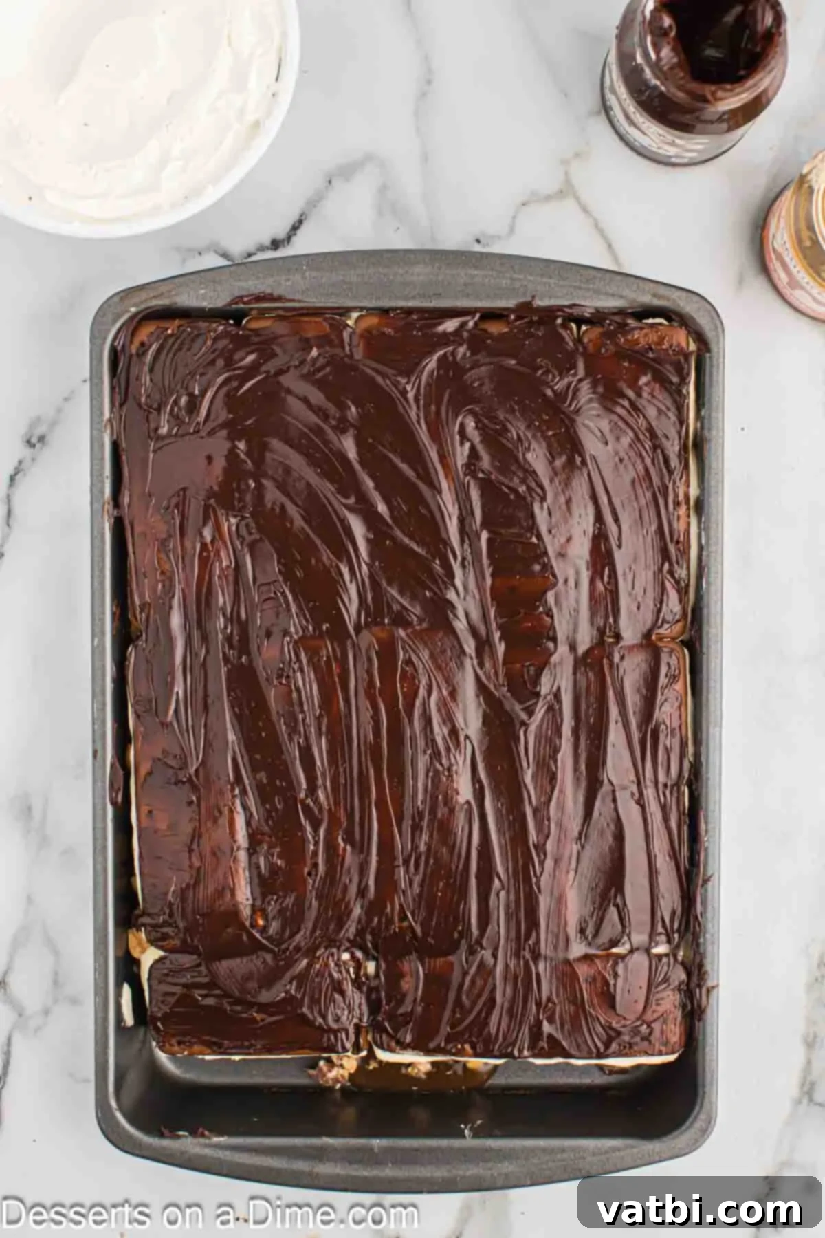 Decadent Snickers Ice Cream Cake 8 Hot fudge layered on top.