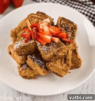 37 Must-Try Brunch Desserts 13 French toast sticks on a plate with syrup.