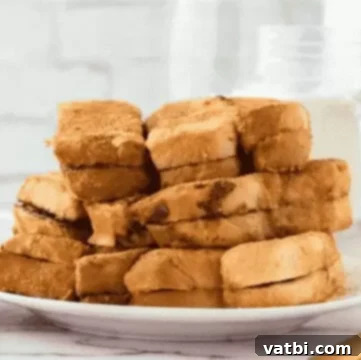 37 Must-Try Brunch Desserts 15 Nutella French Toast garnished with powdered sugar.