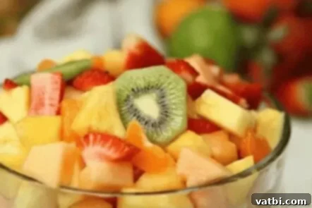 37 Must-Try Brunch Desserts 31 Tropical fruit salad in a large serving bowl.