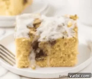 37 Must-Try Brunch Desserts 5 Slice of cinnamon roll cake on a white plate.