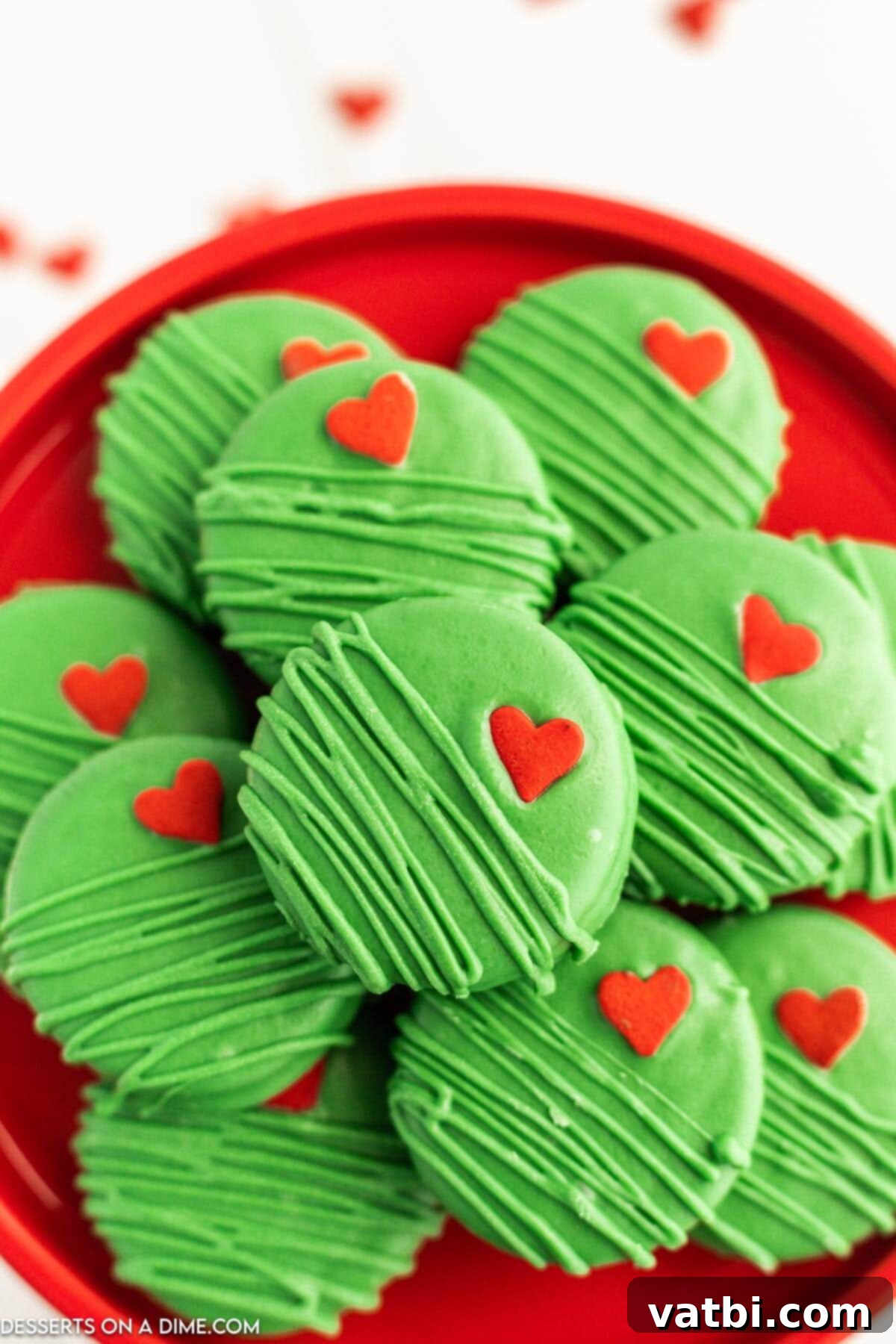 Grinch Chocolate Covered Oreos displayed on a festive platter, ready for holiday celebrations.