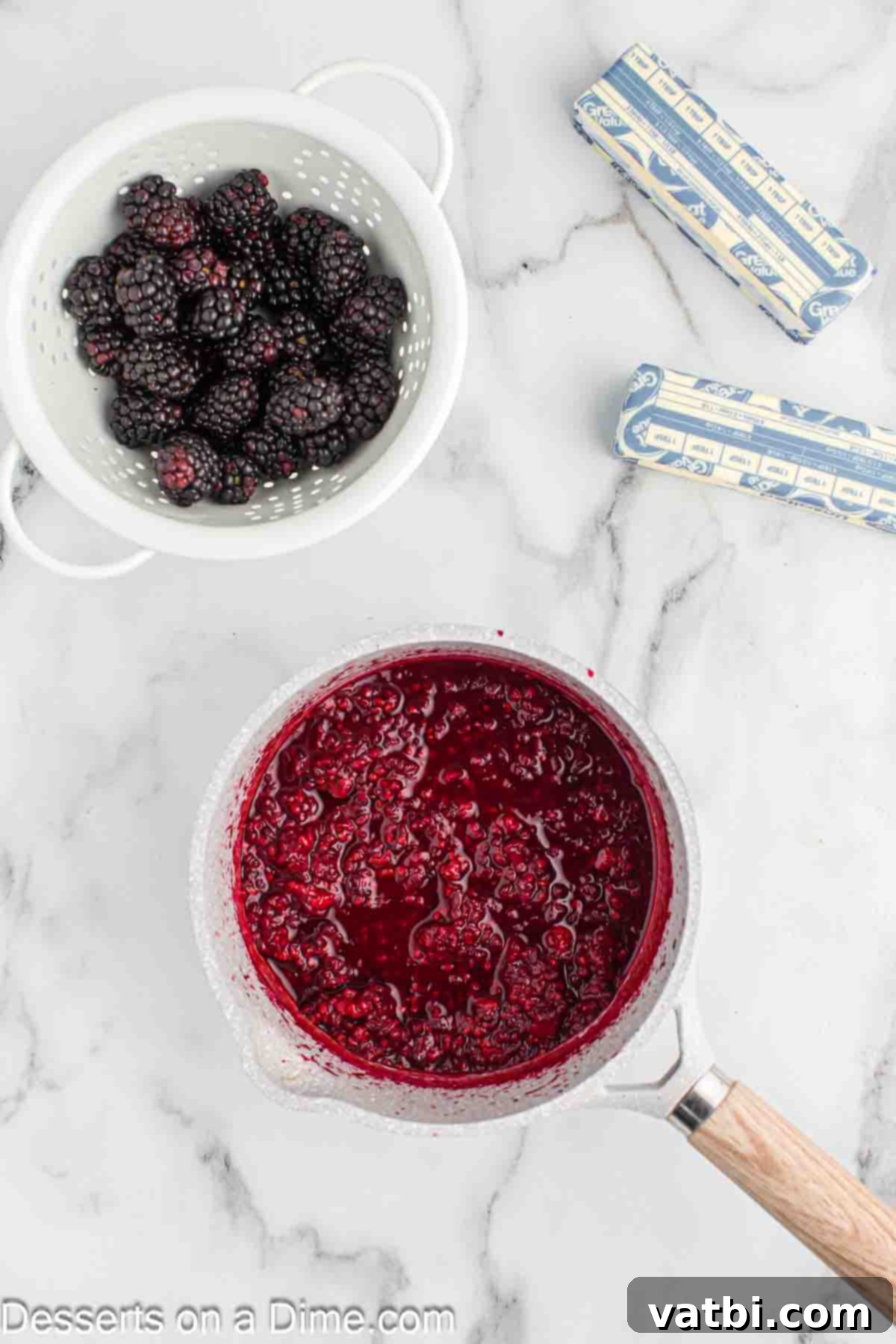 Luscious Blackberry Buttercream Frosting 4 Simmering blackberries and lemon in a saucepan