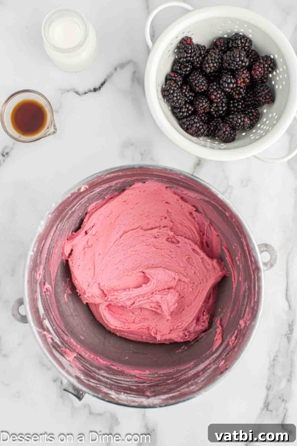 Luscious Blackberry Buttercream Frosting 6 Adding in the powdered sugar into the mixing bowl