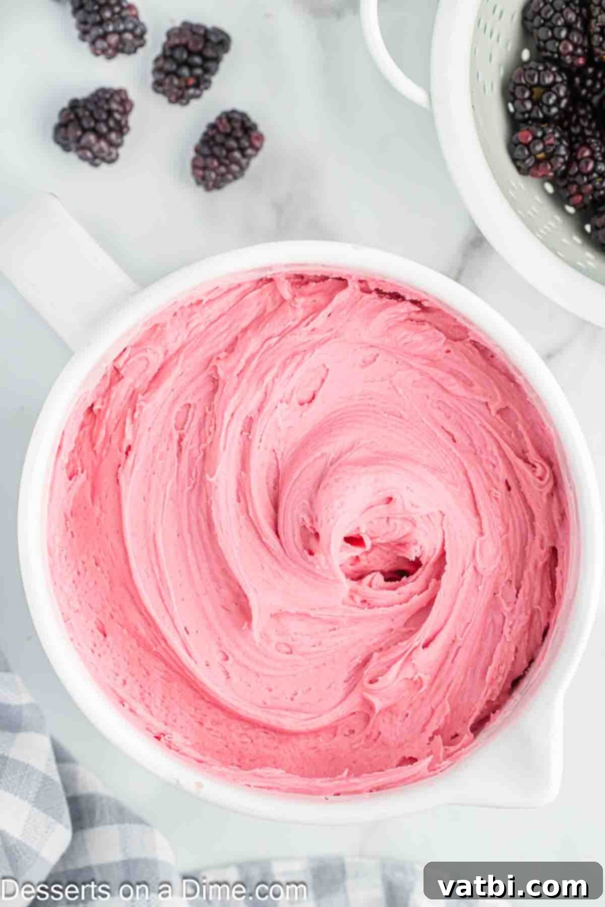 Luscious Blackberry Buttercream Frosting 7 Placing the prepared blackberry frosting in a container