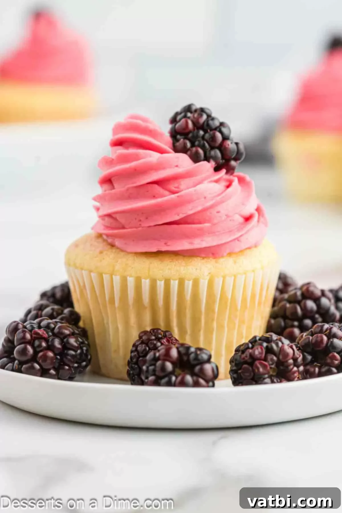 Luscious Blackberry Buttercream Frosting 8 Blackberry Buttercream Frosting on cupcakes.