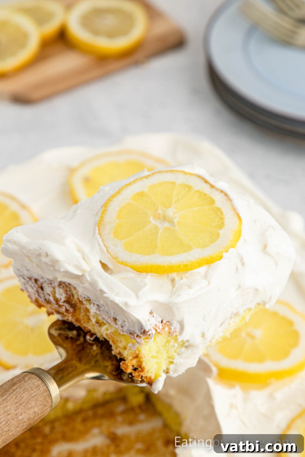 Sunshine Lemon Angel Food Cake 8 Lemon Angel Food Cake cut and being served.