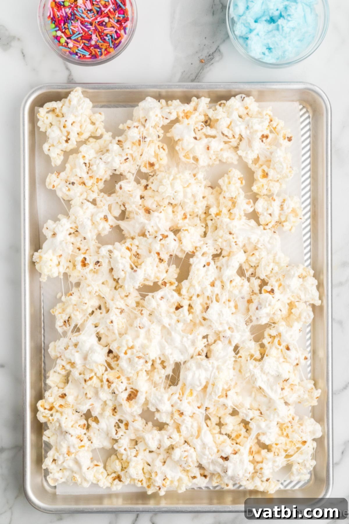 Cloud Nine Crunch 6 Popcorn spread on pan.