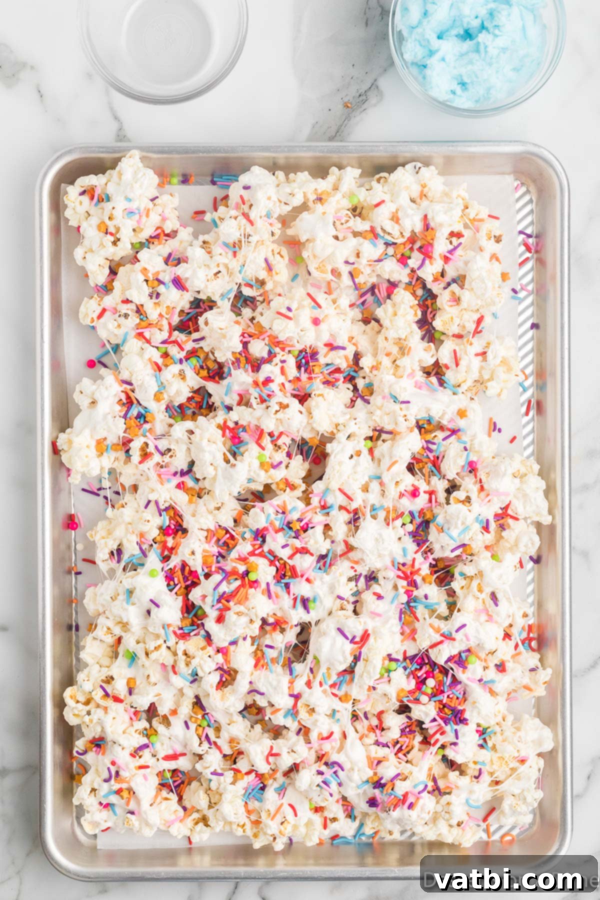 Cloud Nine Crunch 7 Sprinkles added to popcorn.