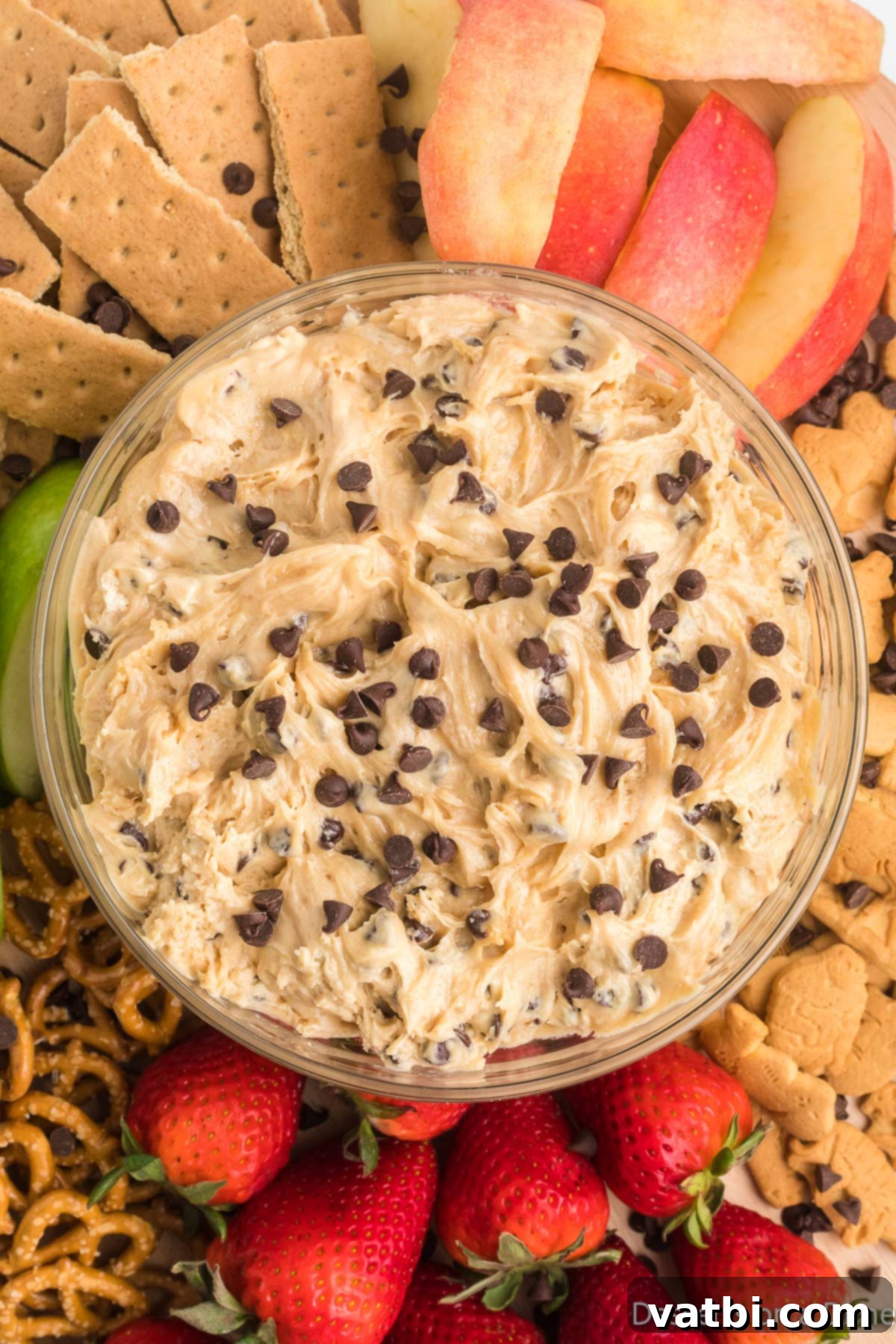 Decadent Buckeye Delight 2 A beautifully presented bowl of Buckeye dip, surrounded by an assortment of dippers like graham crackers, apple slices, and pretzels.