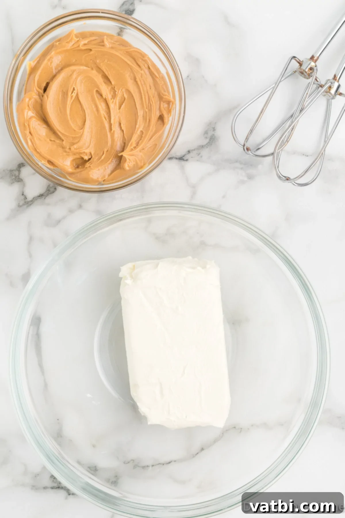 Decadent Buckeye Delight 4 Softened cream cheese in a mixing bowl, ready to be combined with other ingredients.