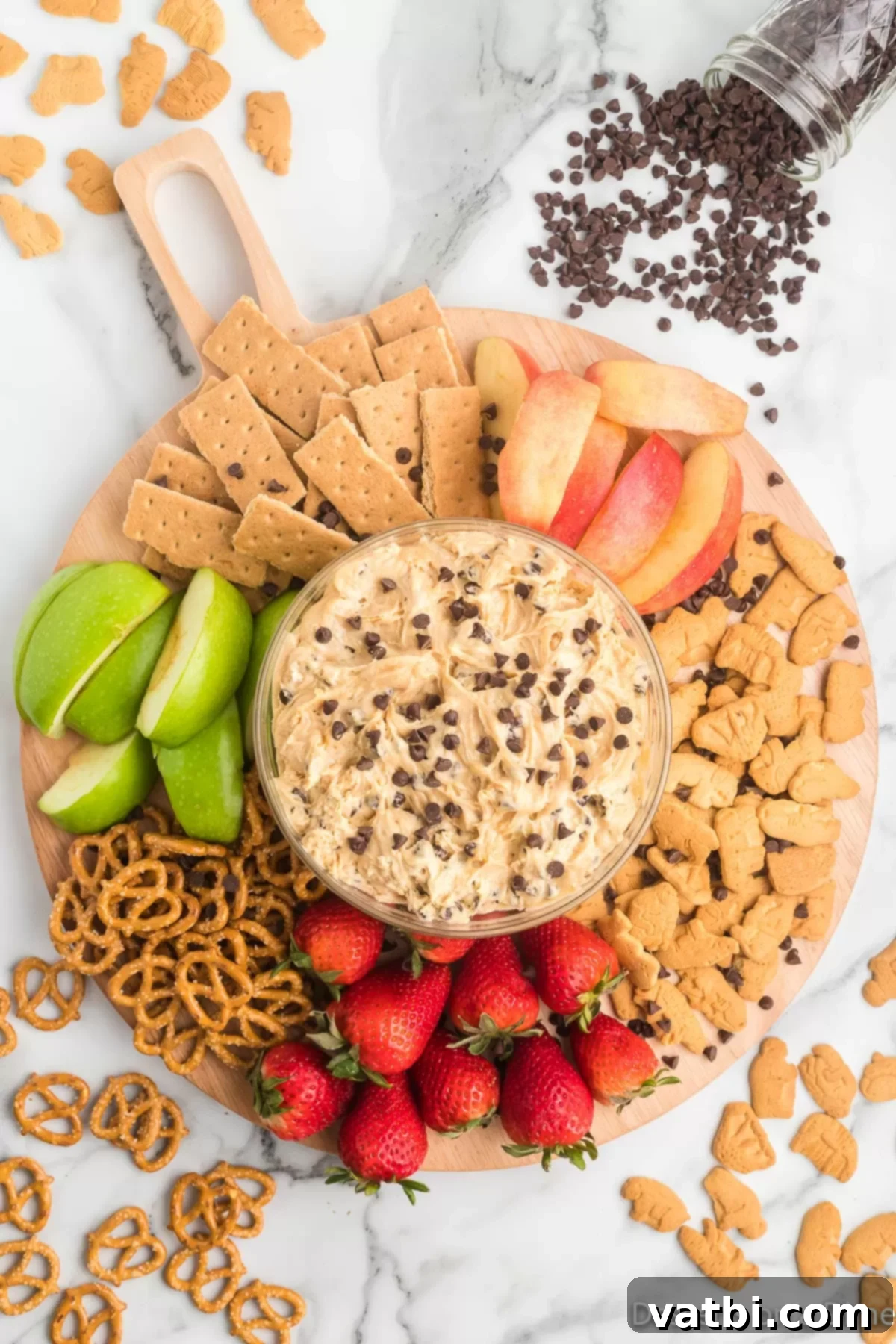 Decadent Buckeye Delight 7 The finished Buckeye dip in a decorative bowl, artfully arranged on a platter with a variety of dippers, ready to serve.