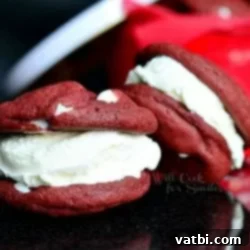 29 Decadent Red Velvet Desserts 6 Red Velvet Ice Cream Sandwich Cookies with colorful candies.
