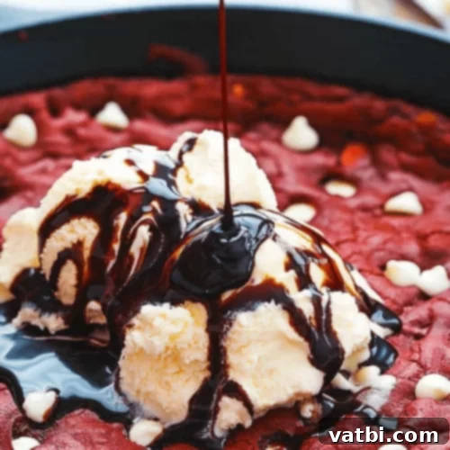 29 Decadent Red Velvet Desserts 8 Red Velvet Skillet Cookie with white chocolate chips.