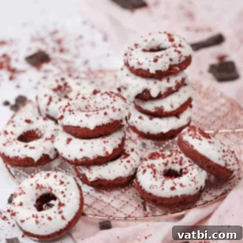 29 Decadent Red Velvet Desserts 11 Red Velvet Donuts topped with cream cheese frosting.