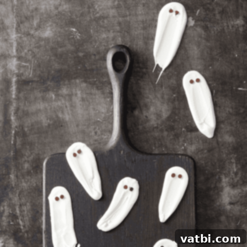 White Chocolate Halloween Ghosts with mini chocolate chip eyes.