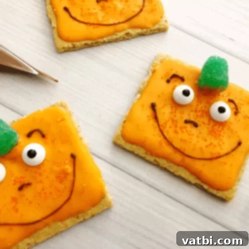 Spookley Square Pumpkin Cookies made from graham crackers, orange candy melts, and sprinkles.