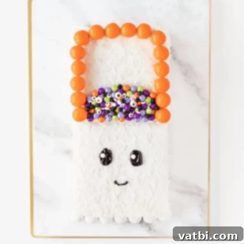 Halloween Trick or Treat Bag Ghost Cake, decorated on a store-bought cake.