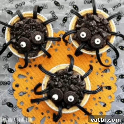 Spider Chocolate Pudding Pies with mini graham cracker crusts.