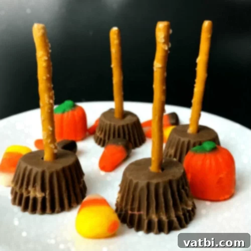 Witch Brooms made from mini peanut butter cups and pretzel sticks.