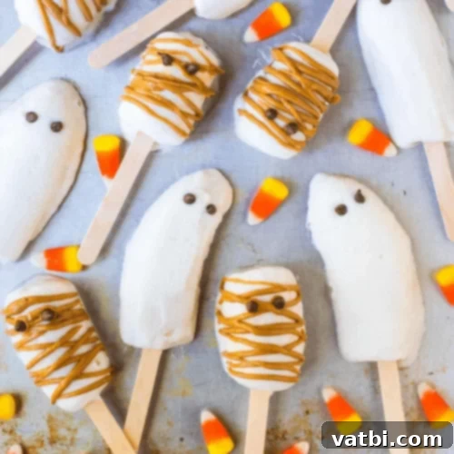 Halloween Banana Popsicles decorated as ghosts and mummies.