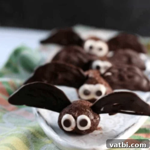 Brownie Bite Halloween Bats with chocolate wings and googly eyes.