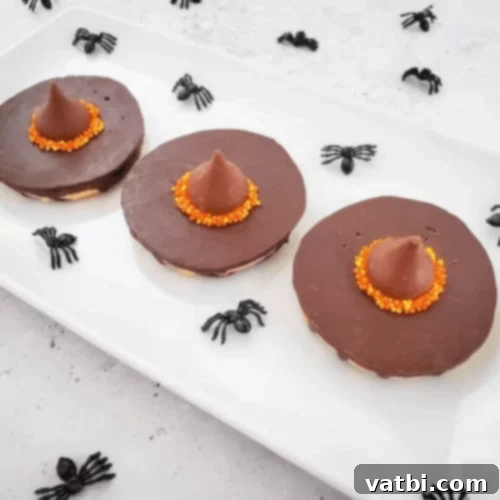 Harry Potter Witch Hat Cookies decorated with sprinkles for Hogwarts houses.