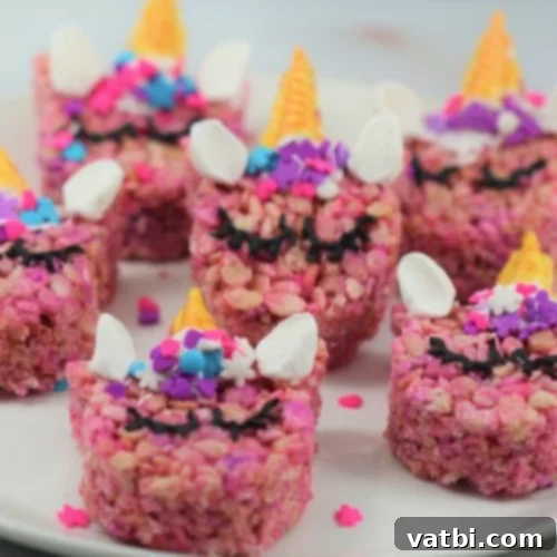 37 Magical Unicorn Desserts 10 Unicorn Rice Krispies Treats with chocolate horns coated in gold food coloring.