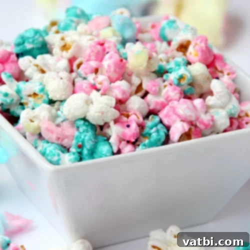 37 Magical Unicorn Desserts 15 Cotton Candy Popcorn coated in candy with sprinkles and cotton candy pieces.