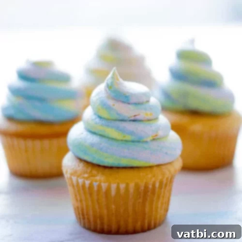 37 Magical Unicorn Desserts 16 Unicorn Poop Cupcakes with rainbow swirls and sprinkles.
