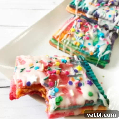 37 Magical Unicorn Desserts 18 Unicorn Pop Tarts with strawberry jam filling, whipped cream, and sprinkles.