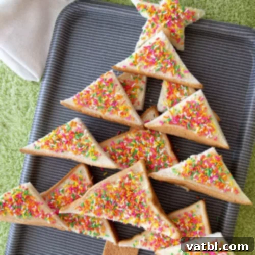 37 Magical Unicorn Desserts 32 Fairy Bread, a colorful party treat made with white bread, butter, and sprinkles.