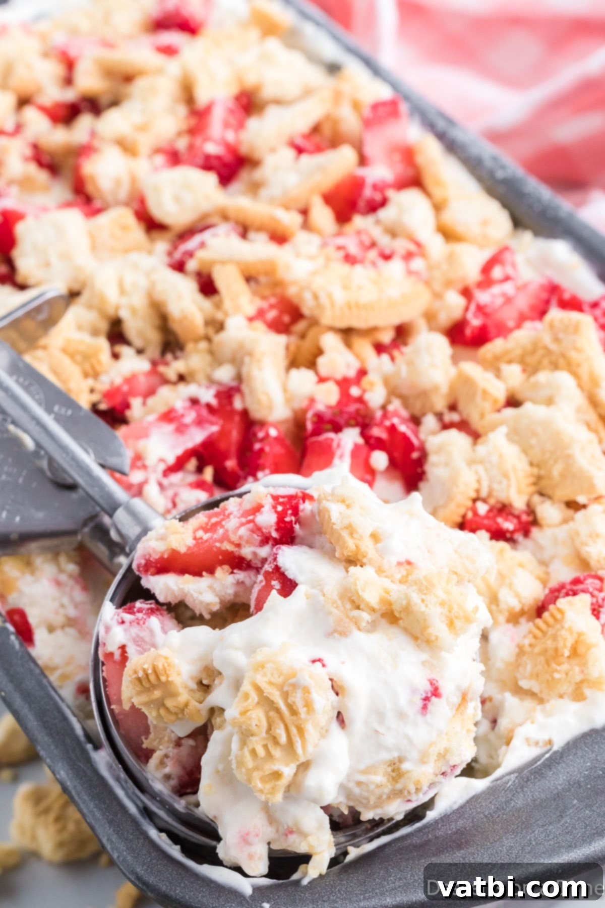 Blissful Strawberry Shortcake Ice Cream 2 Strawberry shortcake ice cream in an ice cream scoop.