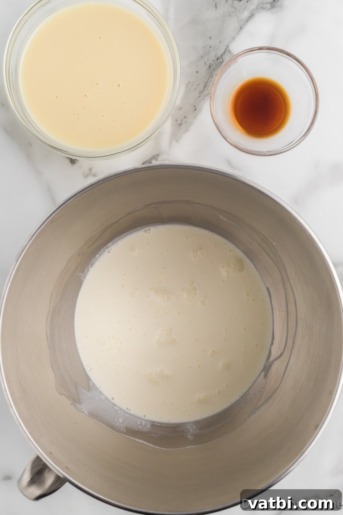 Blissful Strawberry Shortcake Ice Cream 4 Mixing bowl with sweetened condensed milk, heavy cream and vanilla.
