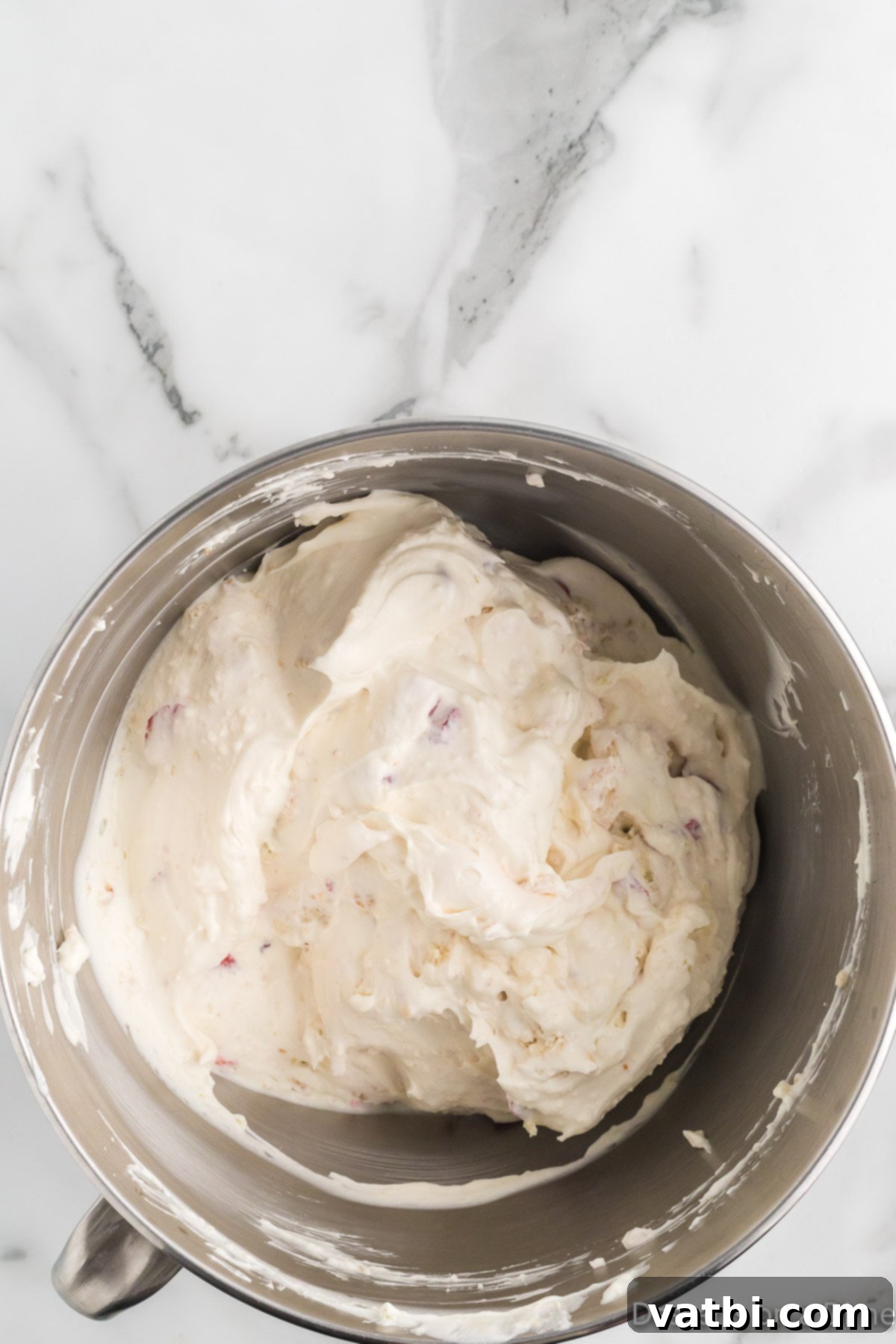 Blissful Strawberry Shortcake Ice Cream 7 Ingredients folded into ice cream base.